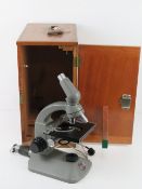 A Beck London Diamax 44278 microscope in wooden carry case having drawer pulling out to reveal