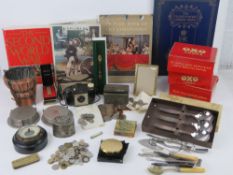 A green painted storage trunk containing a quantity of assorted collectibles inc money boxes with