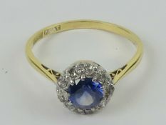 A superb sapphire and diamond ring, the central round cut sapphire of clear cornflower blue hue,