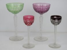 A matched pair of delightful coloured glass hock glasses 20cm high, in purple and green,