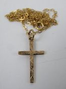 A 9ct rose gold crucifix on 9ct gold chain necklace,