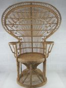 A wicker work 'peacock' chair.