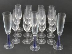 A set of thirteen Stolzle Champagne flutes together with a set of three Champagne flutes having