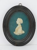 A miniature carved portrait of a Georgian woman in fine dress,