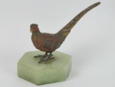 A cold cast bronze sculpture of a pheasant raised over marble base, 11cm wide, slightly a/f to tail.