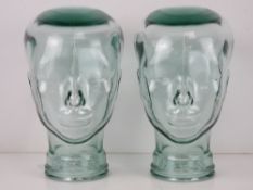 Two heavy glass 'mannequin' display heads, approx 30cm high.