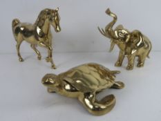 Three brass animal ornaments being horse, elephant and turtle, turtle approx 30cm in length.