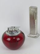 A silver plated Dunhill 'tallboy' Rollagas table lighter together with a Ronson red perspex table