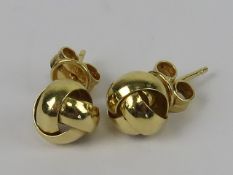 A pair of 18ct gold knot style earrings, hallmarked 750 to post, with butterfly backs, 2g.