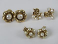 Three pairs of 9ct gold and pearl stud earrings, each hallmarked 375 and having butterfly backs.