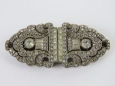 A finely made Art Deco metamorphic brooch having silver front (stamped 935) and probably French,