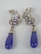 A pair of purple jade and silver earrings in presentation box,
