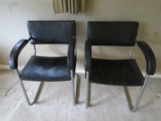 A pair of c1960s aluminium framed (retro) chairs with black leatherette upholstery.
