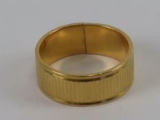 A 22ct gold band ring, having been cut (a/f), hallmarked for London, size N-O, 7.2g.