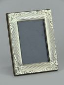 An HM silver photograph frame, overall size 6.5 x 8.5cm.