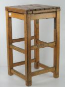 A pine stool having slatted seat, 35 x 35 x 63.5cm.