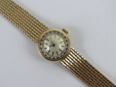 A 9ct gold ladies Omega cocktail wristwatch on integral strap, hallmarked 375,