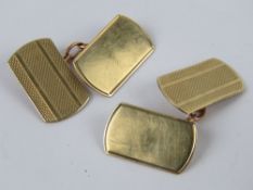 A pair of 9ct gold cufflinks having engine turned engraved pattern upon, 3.