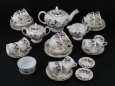 A tea and coffee service by Wedgwood in Hathaway Road pattern comprising teapot, lidded sugar bowl,