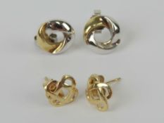 A pair of 9ct white and yellow gold knot style earrings, hallmarked 375.