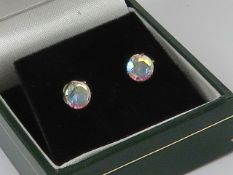 A pair of stud earrings, 9ct gold butterfly backs, claw set multi colour stone. In presentation box.