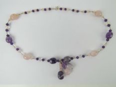 A rose quartz and amethyst agate necklace having silver beads and 925 silver clasp.