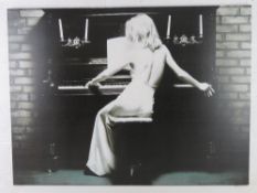 A large canvas print of a woman in eveni