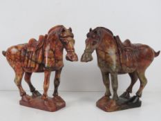 A fine opposing pair of carved marble In