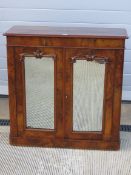 A good walnut half veneered two door flo