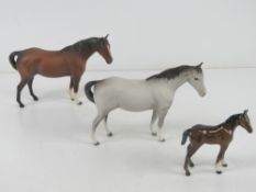 Beswick; A matt dapple grey pony togethe