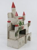 A vintage hand made castle dolls house,