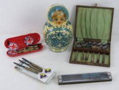 A set of darts in Renault case, together with another set of darts my by Unicorn,