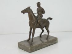 A cold cast bronze sculpture of jockey o