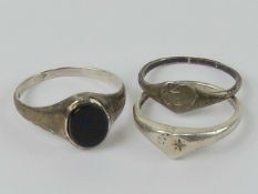 Three silver rings including heart shape