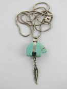 A silver snake link chain necklace havin