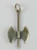 A silver pendant in the form of a battle