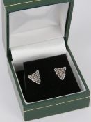 A pair of silver leopards head earrings,