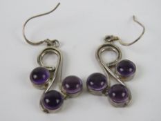 A pair of silver amethyst earrings each