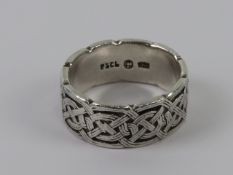 A silver Celtic knot design ring, stampe