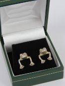 A pair of two sectional frog earrings, n