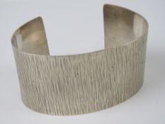 A 1970s style sterling silver bark effec