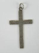A silver crucifix pendant having scrolli