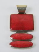 A HM silver and faux coral pendant, two