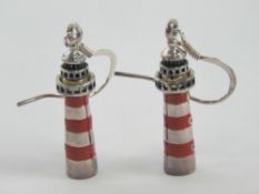 A pair of re and black enamel earrings e