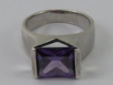 A silver and amethyst ring, rectangular