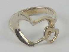 A silver ring in the form of two hearts,