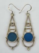A pair of silver geometric earrings, sta