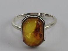 A silver and Baltic amber ring, octagona