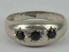 A silver three stone gypsy ring, stamped