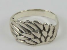 A silver ring in the form of a wing, sta